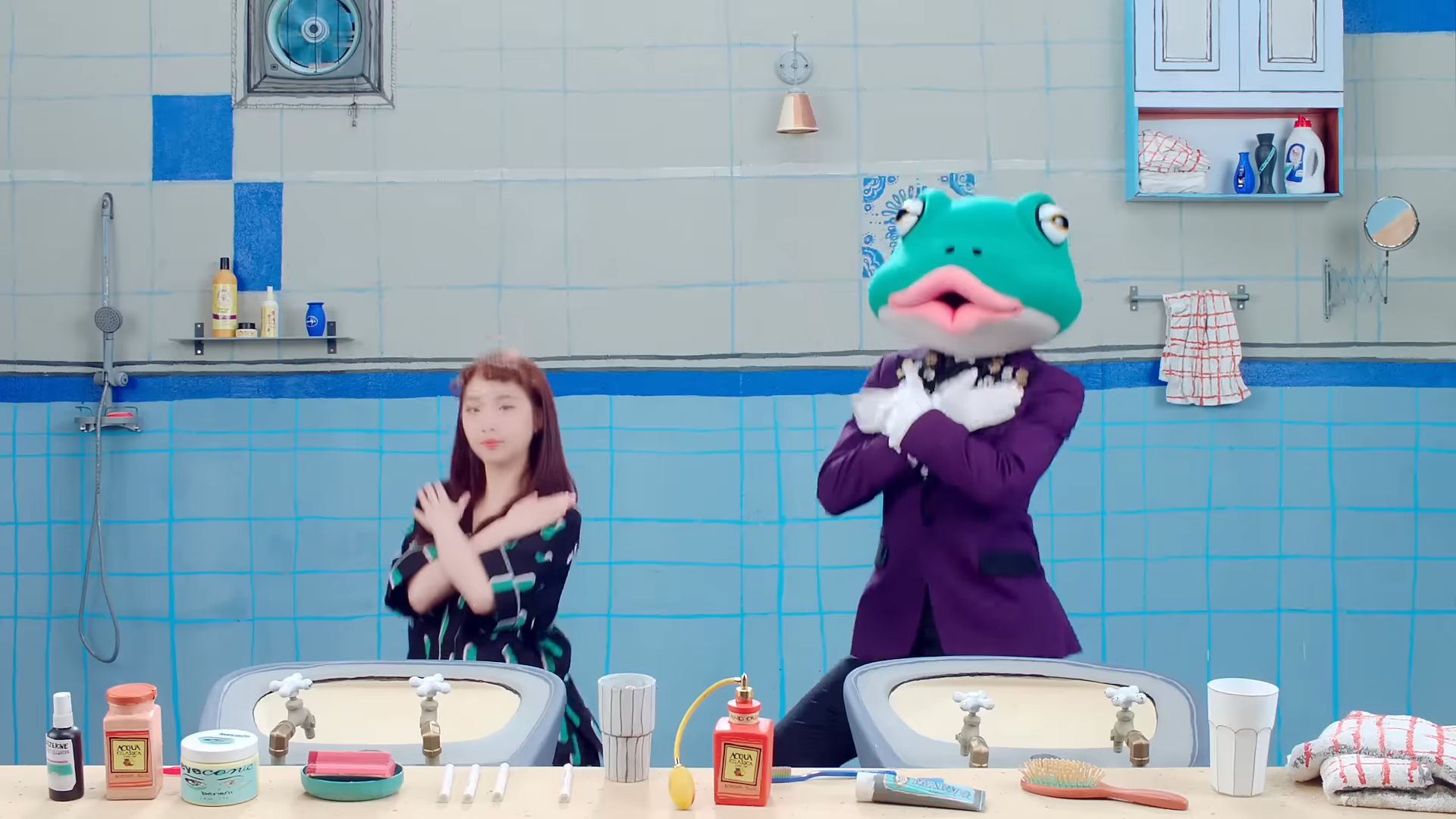 Yeojin and the frog dancing in the bathroom.